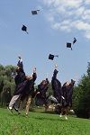 High school graduates jumping for joy photo