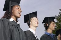 Graduation photo: three graduates looking ahead