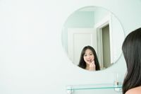 Photo of girl looking in mirror. How important is outward appearance really?