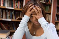 Photo of worried girl in college setting